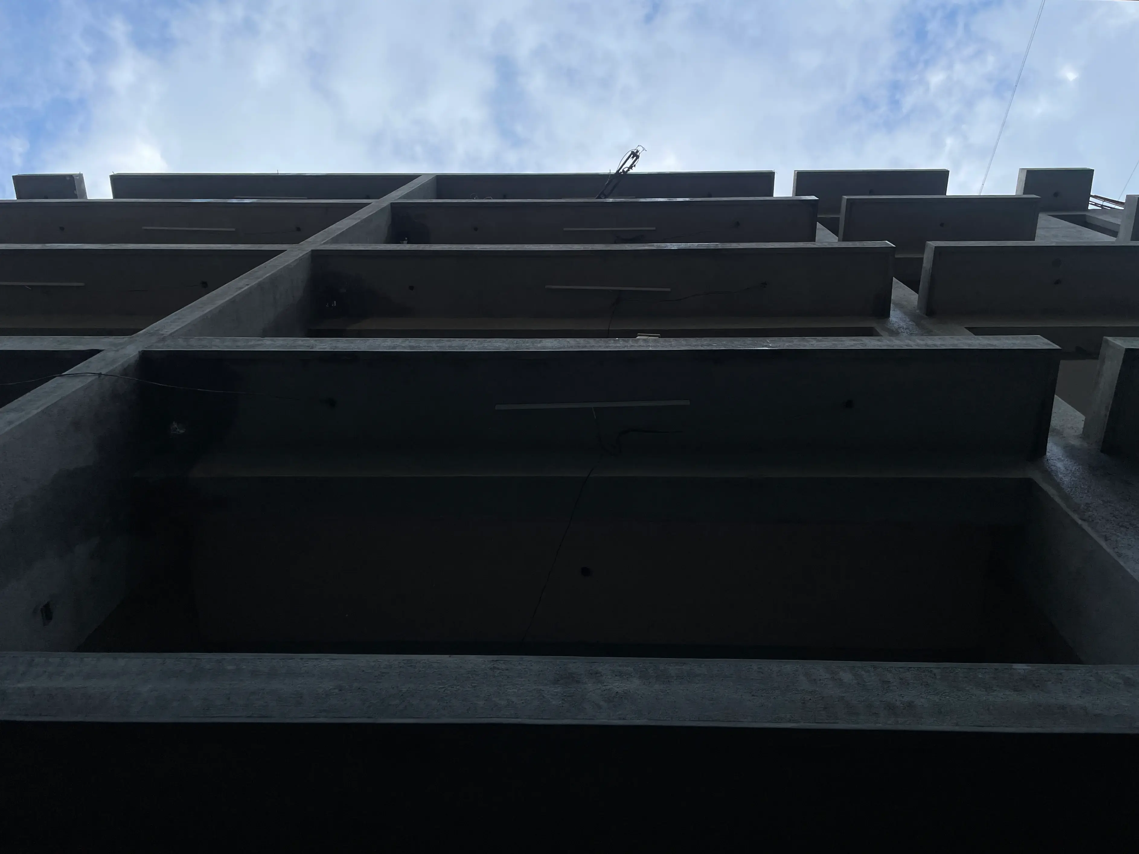 New Castle superstructure and façade language emerging above the lower levels